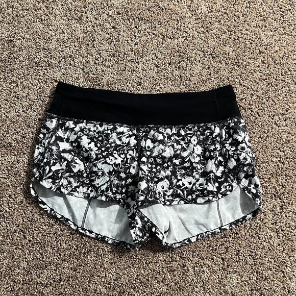 Lululemon Running Shorts Womens 4 Black White Floral Lined Zip Pocket Split Hem - Picture 1 of 8